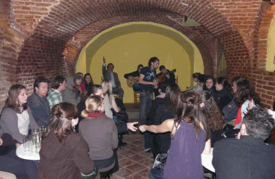People watch under the brick arquitecture. TEFL Students in the limelight.