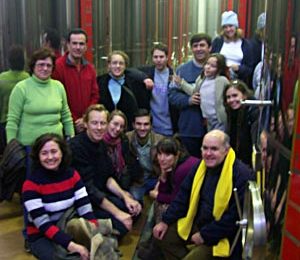 Group shot between the huge vats of oil